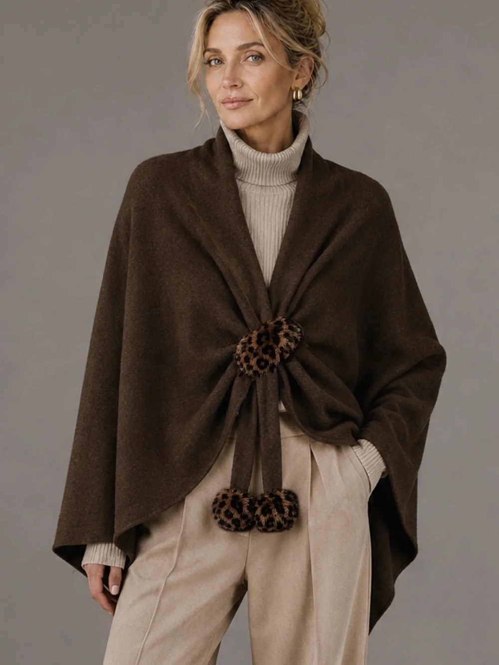 Cozy Brown Poncho-Style Sweater with Leopard Pom Details